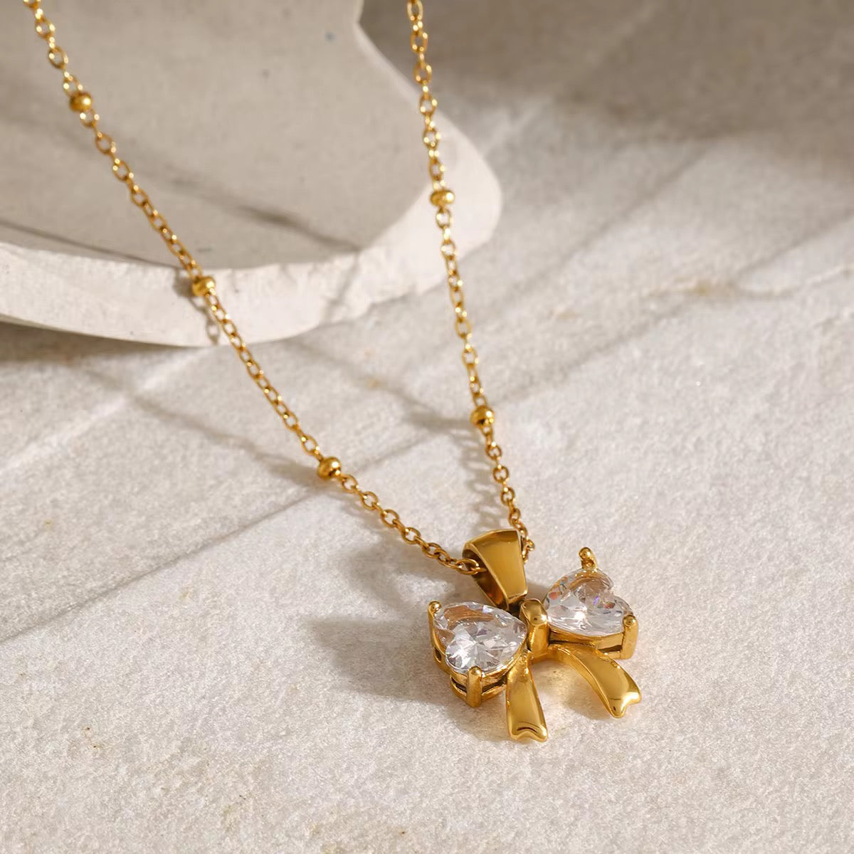 Zirconia bow necklace