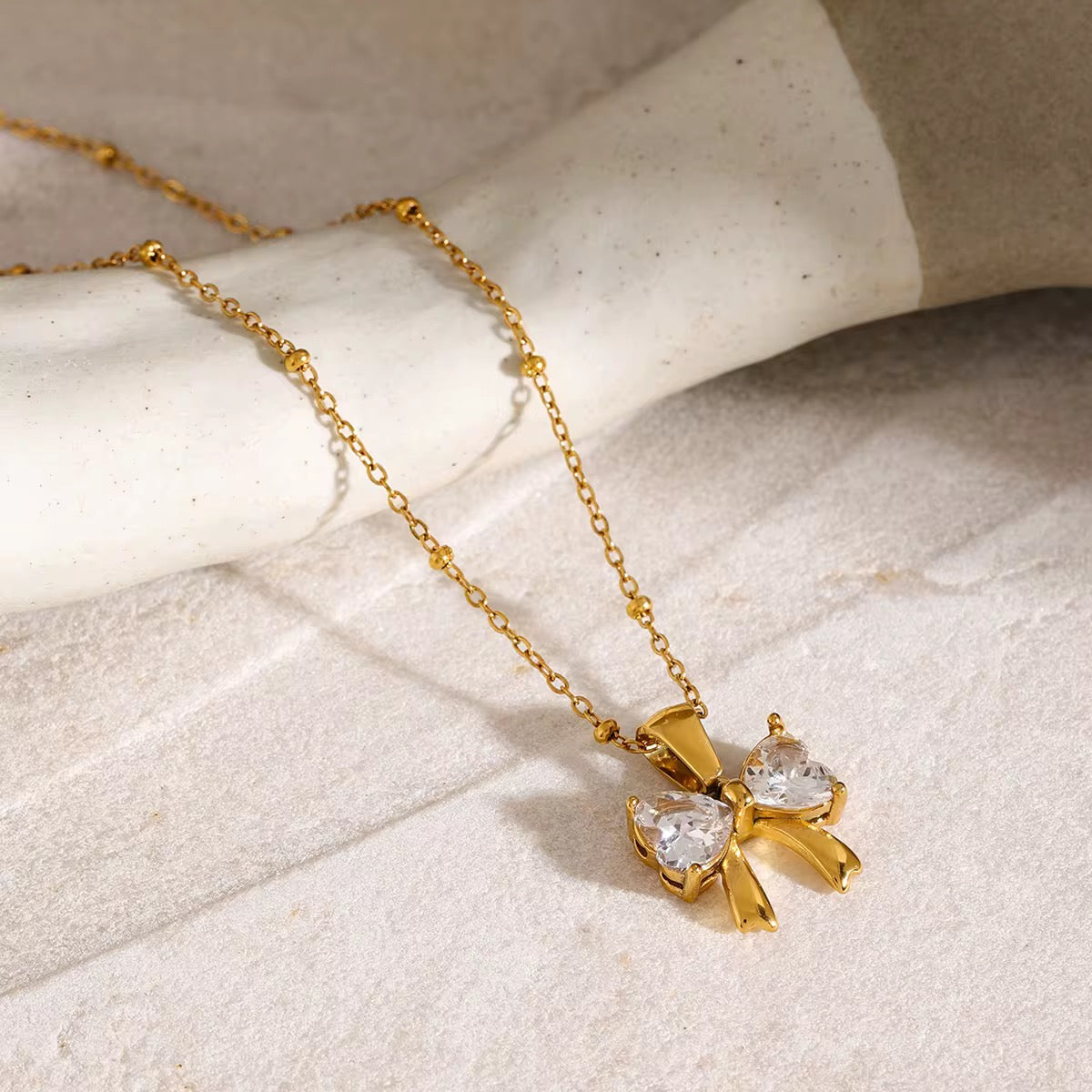 Zirconia bow necklace